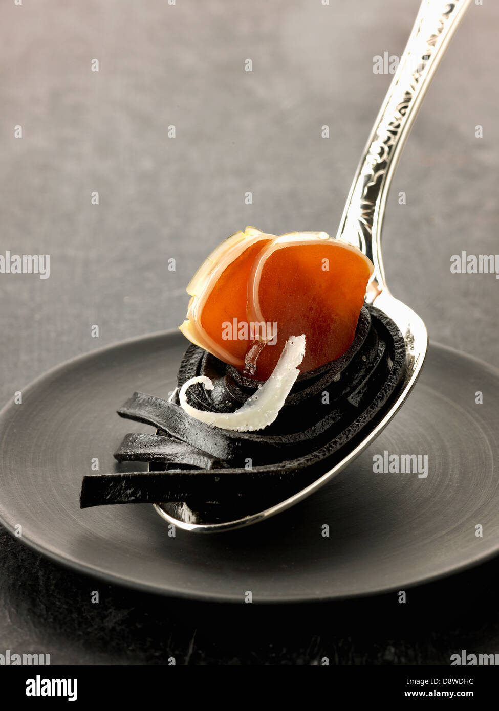Squid ink pasta with poutargue Stock Photo