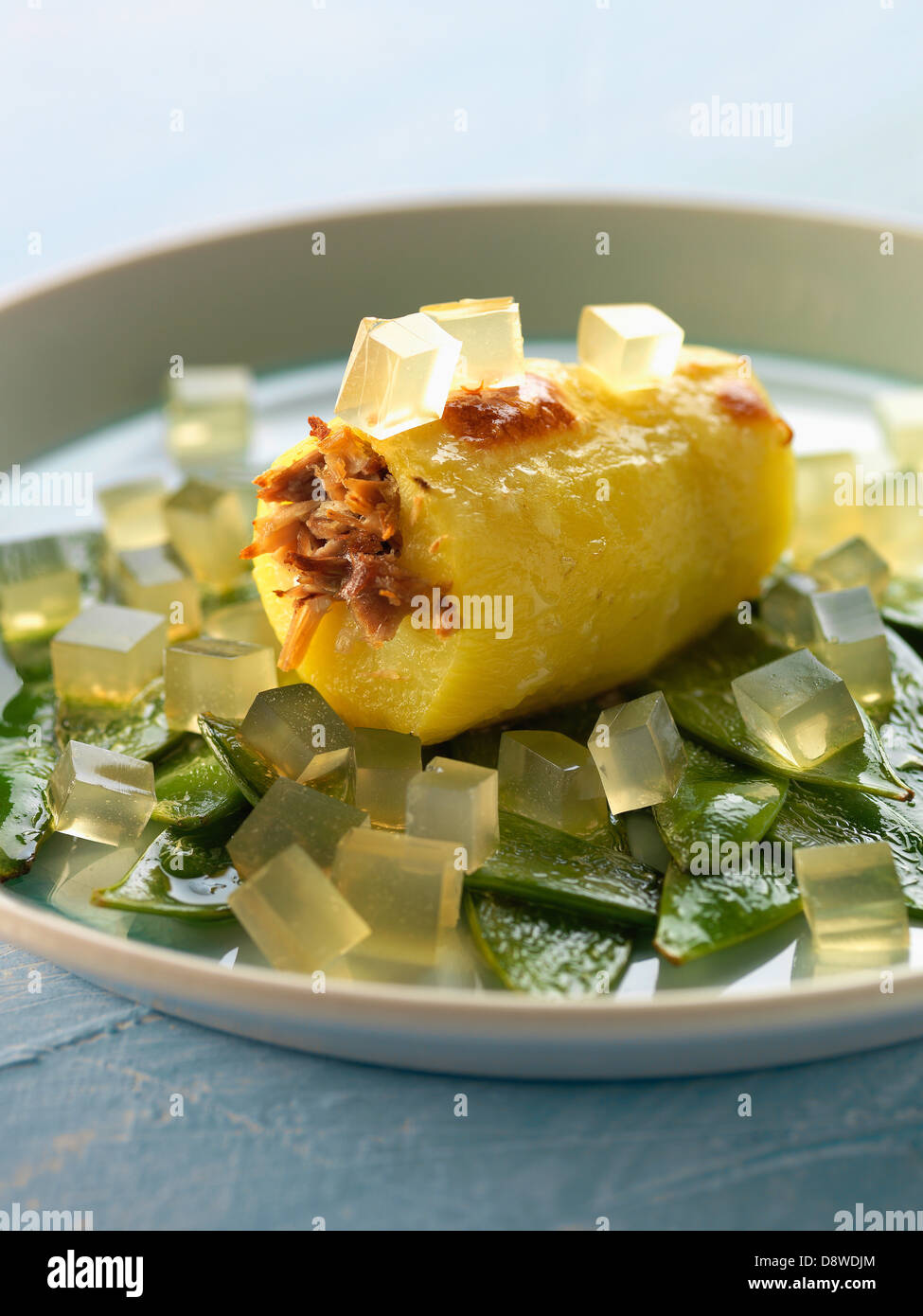 Potato stuffed with duck,sugar peas and diced aspic Stock Photo