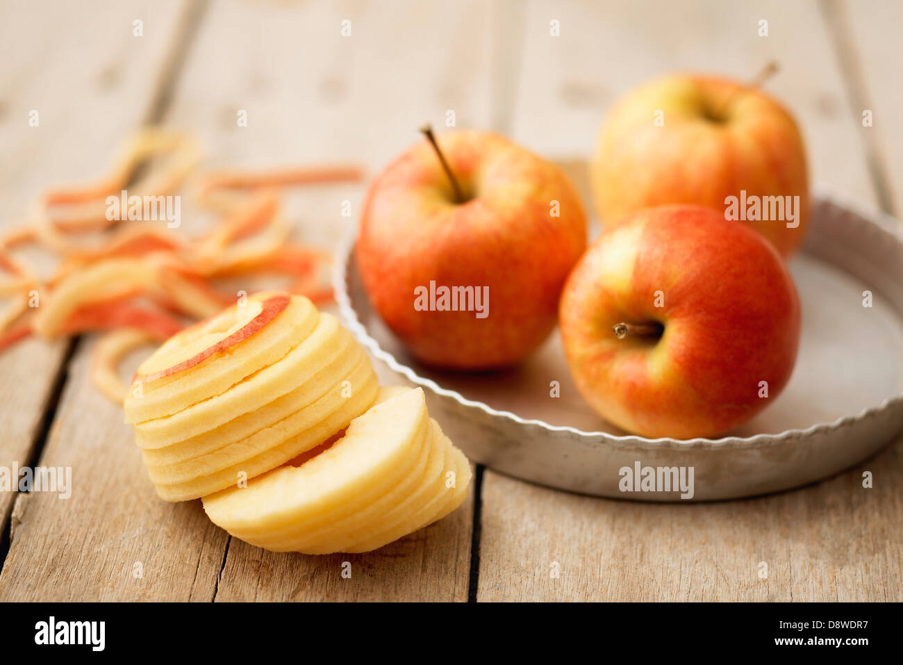 Peeling and slicing apples for a tart Stock Photo