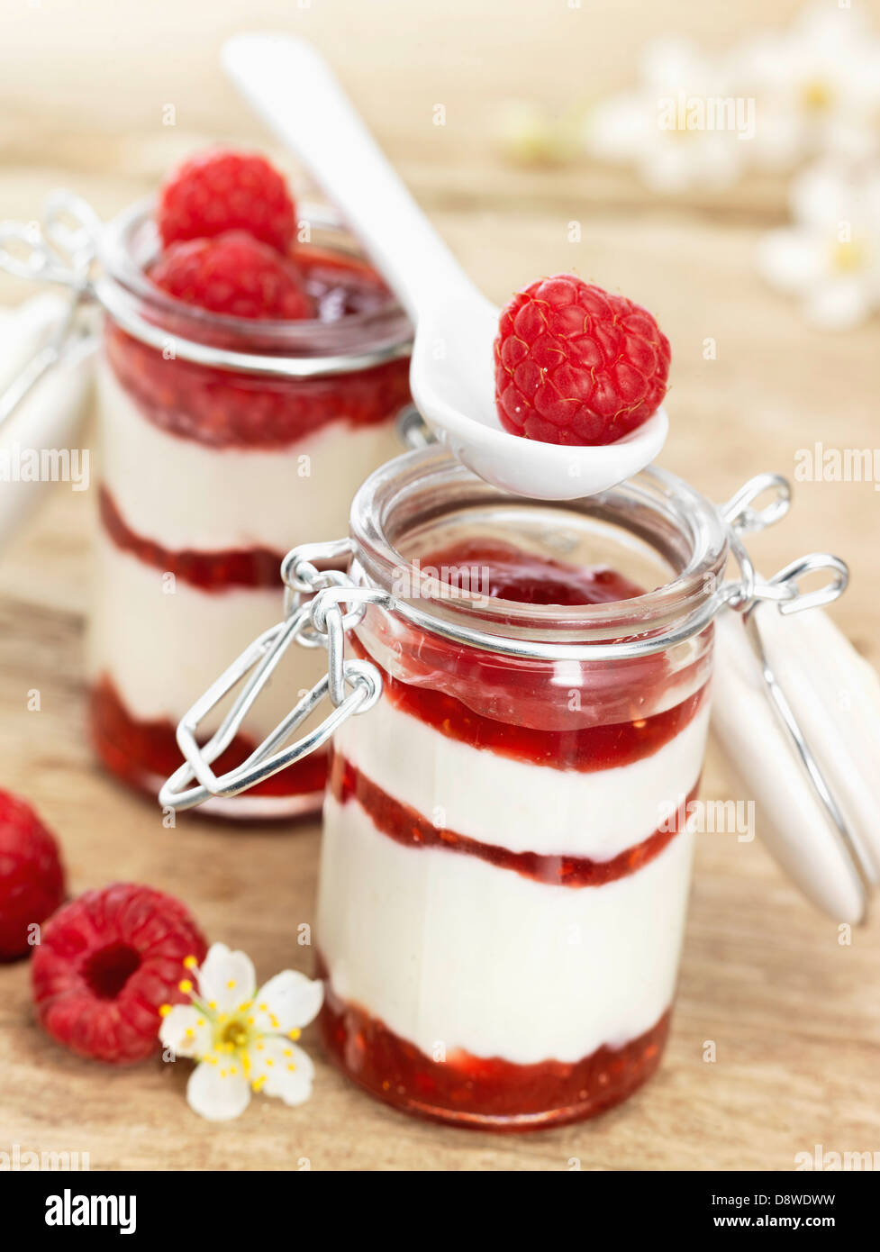 Individual jars of fromage blanc with raspberry puree Stock Photo