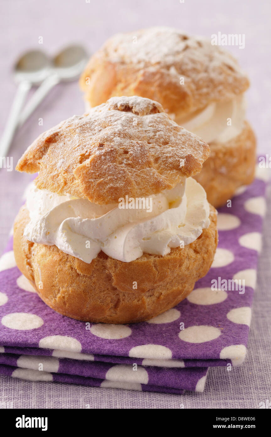 Choux buns filled with whipped cream Stock Photo