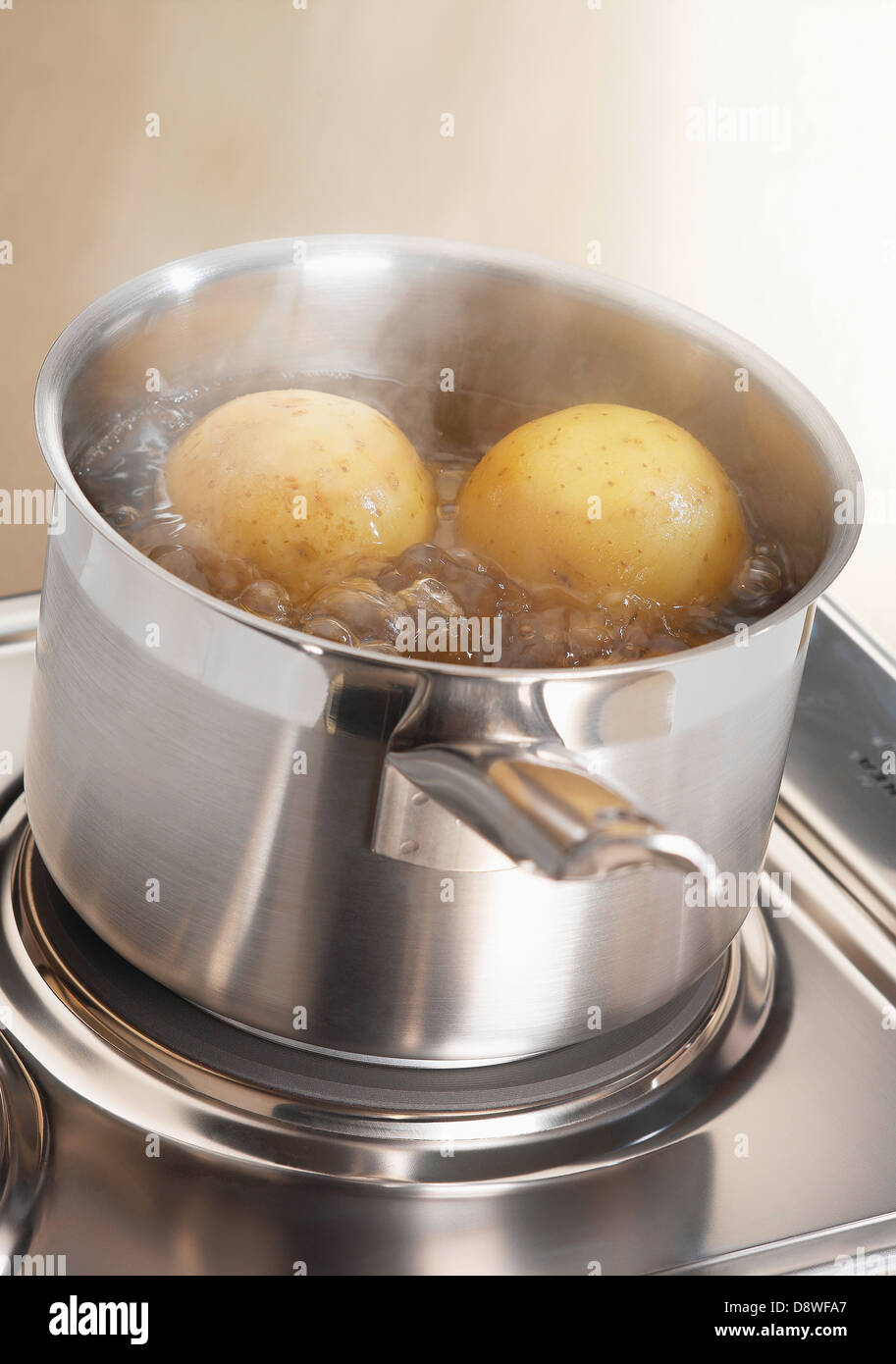 Boiling potatoes in a saucepan Stock Photo Alamy