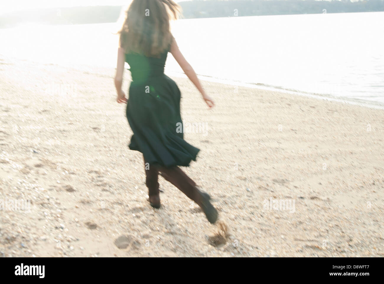 Woman running dress rear view hi-res stock photography and images - Alamy