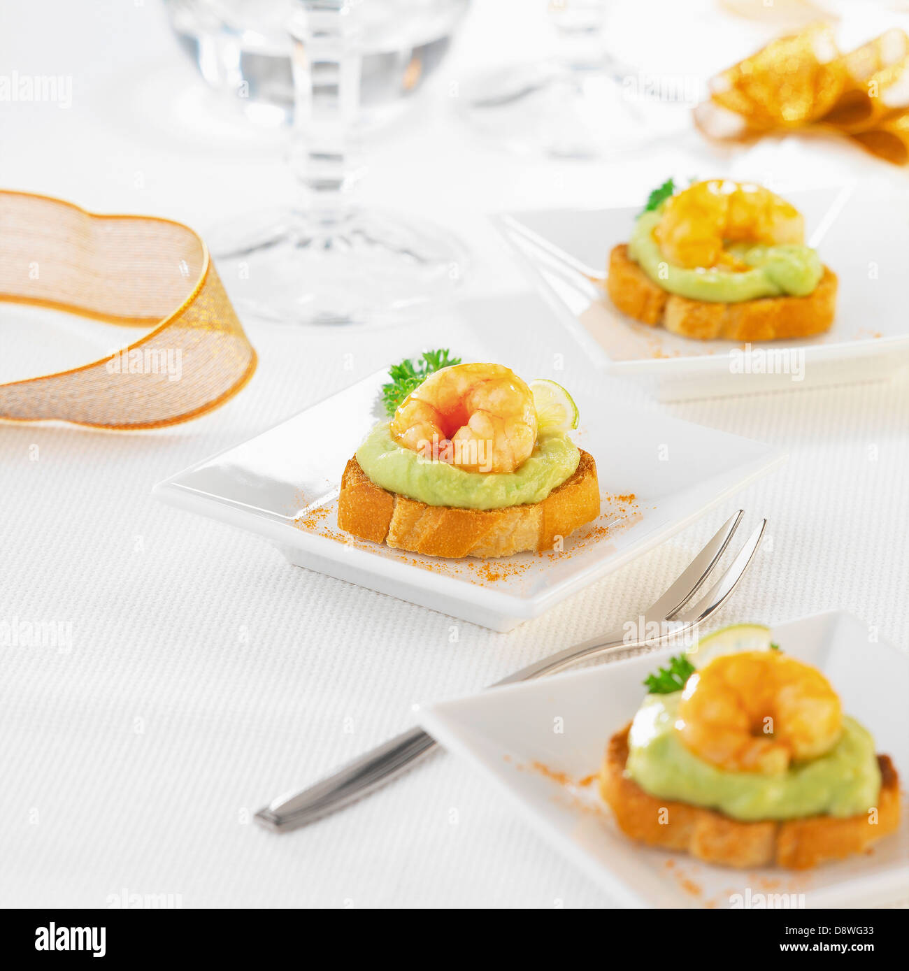 Guacamole and shrimp mini toasts Stock Photo - Alamy