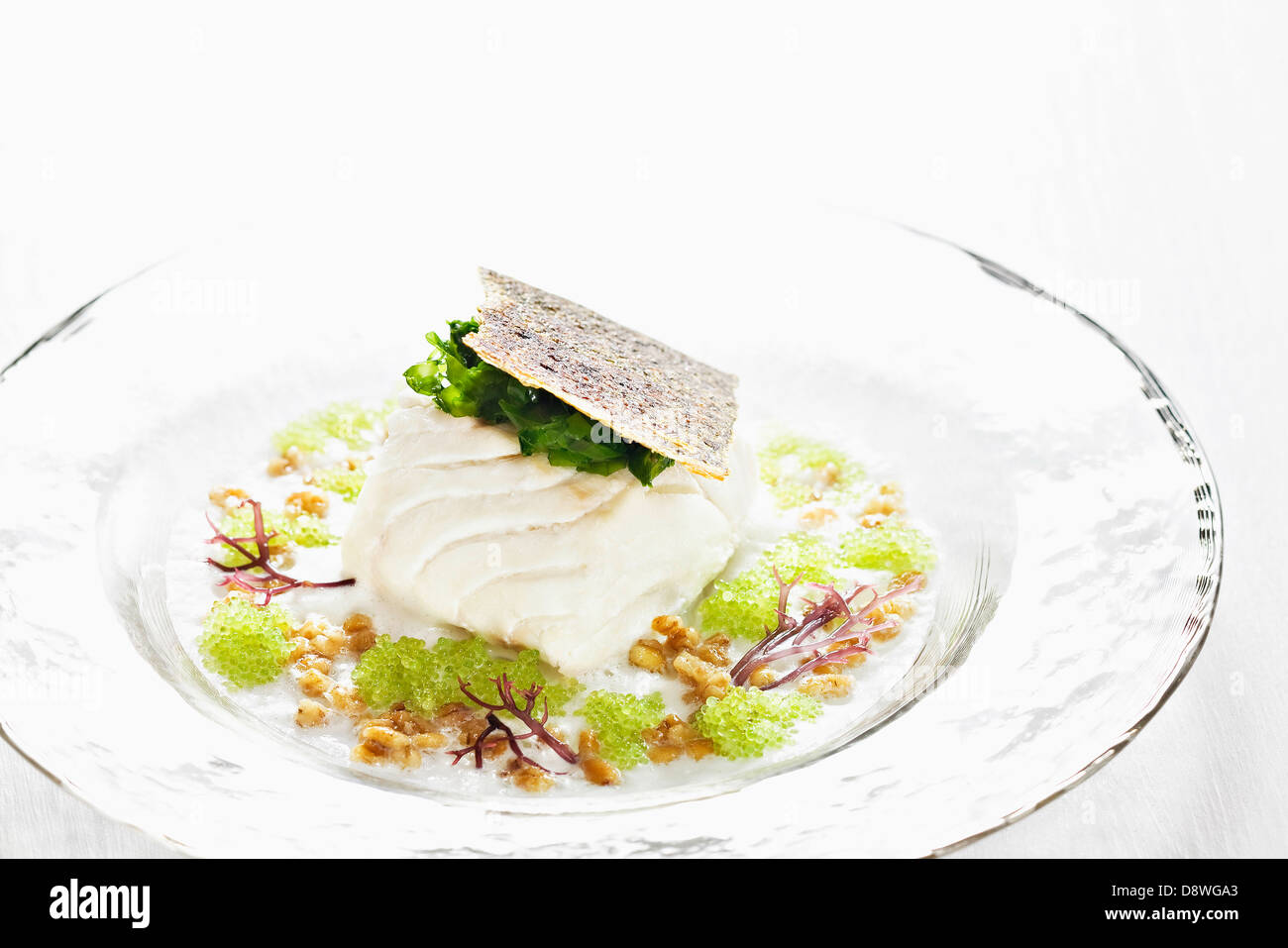 Poached cod with sea lettuce,barley and batfish roe with wasabi Stock Photo