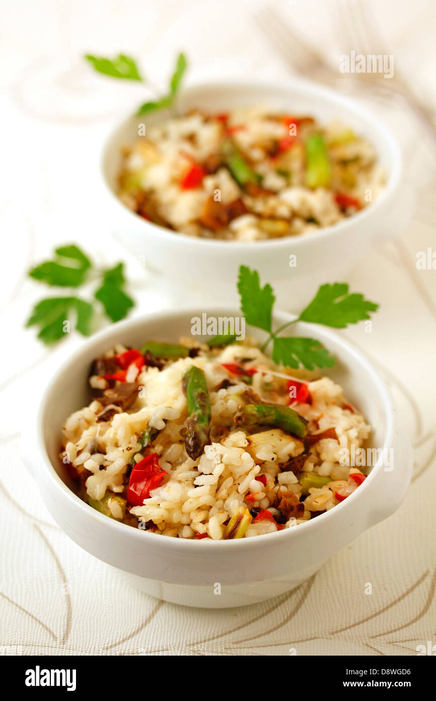 Risotto with mushrooms and wild asparagus. Recipe available. Stock Photo