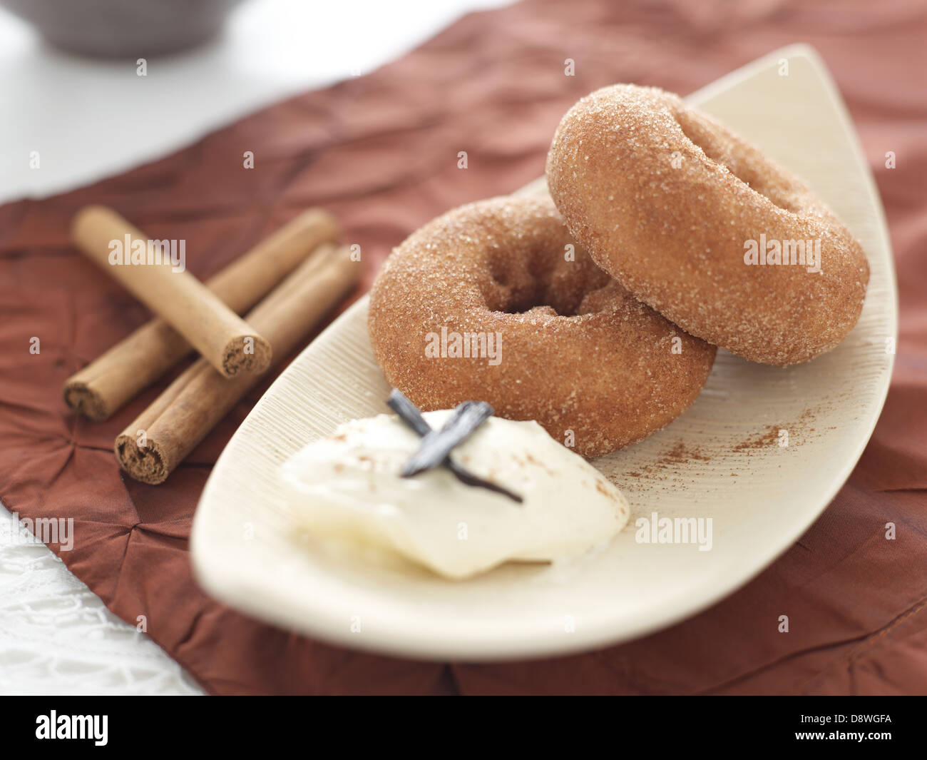 ring doughnuts donuts icecream cream cinnamon sticks Stock Photo