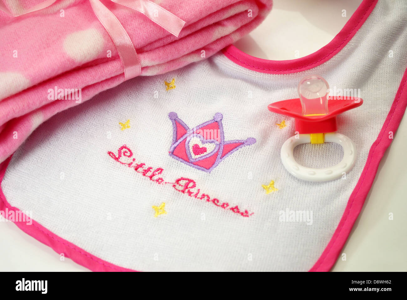Pretty in Pink Baby;Bib, Pacifier and Blanket Stock Photo