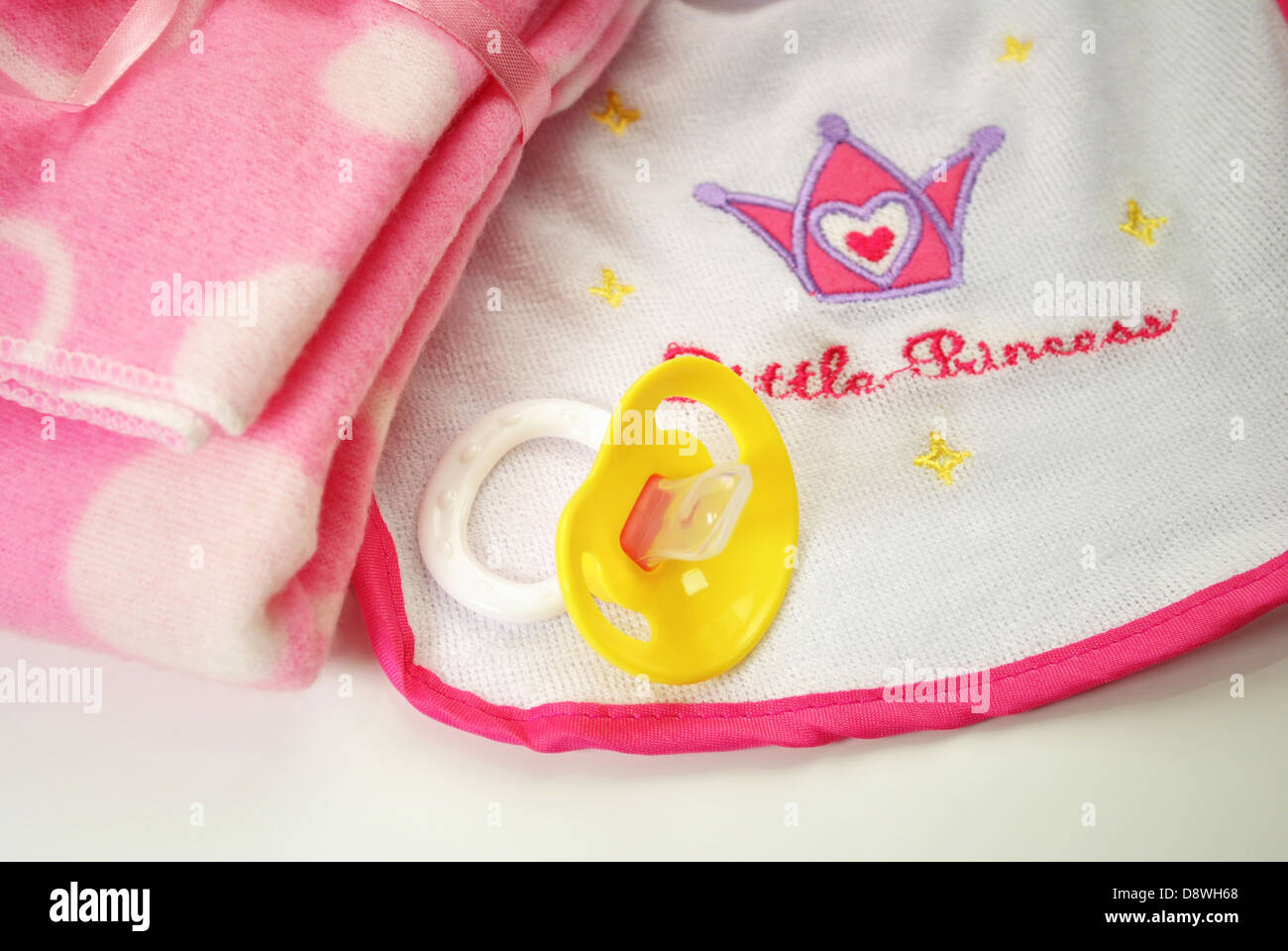 Pink and White Bib with a Binky and Blanket Stock Photo