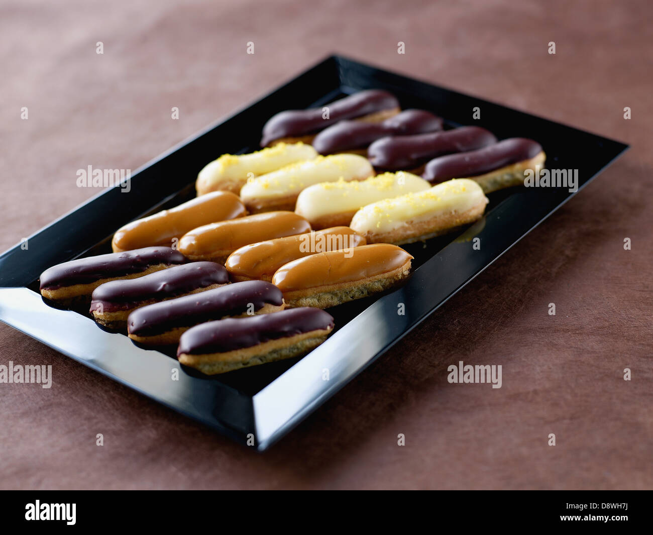 Tray of baby Eclairs for a cocktail by Dalloyau Stock Photo