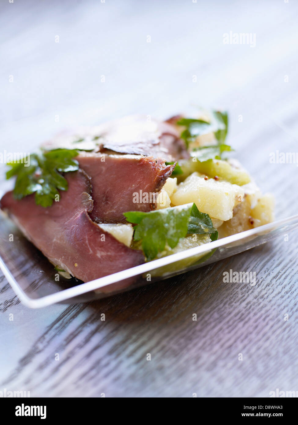 Cold roast beef with potato salad Stock Photo