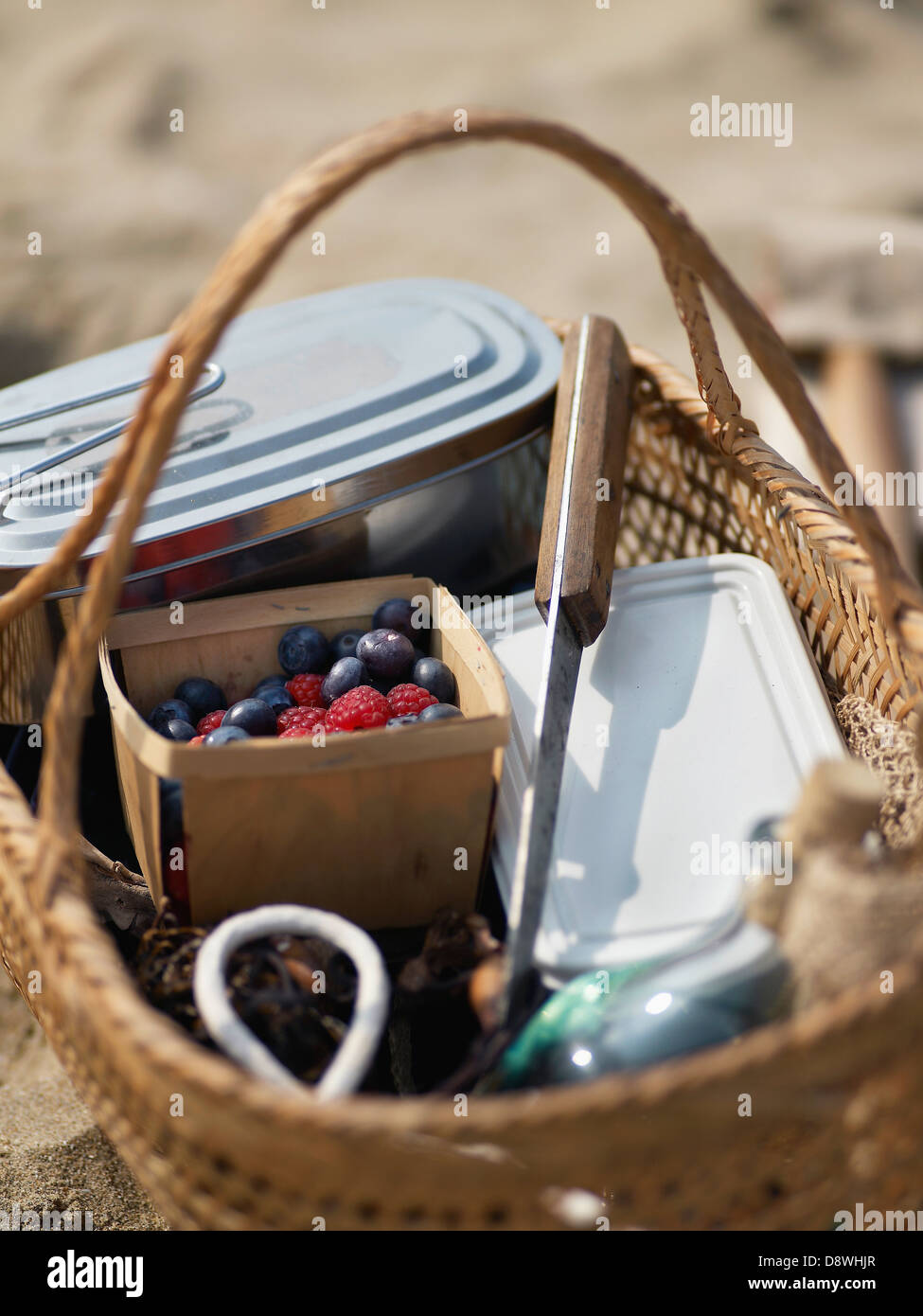 Picnic basket on the beach Stock Photo