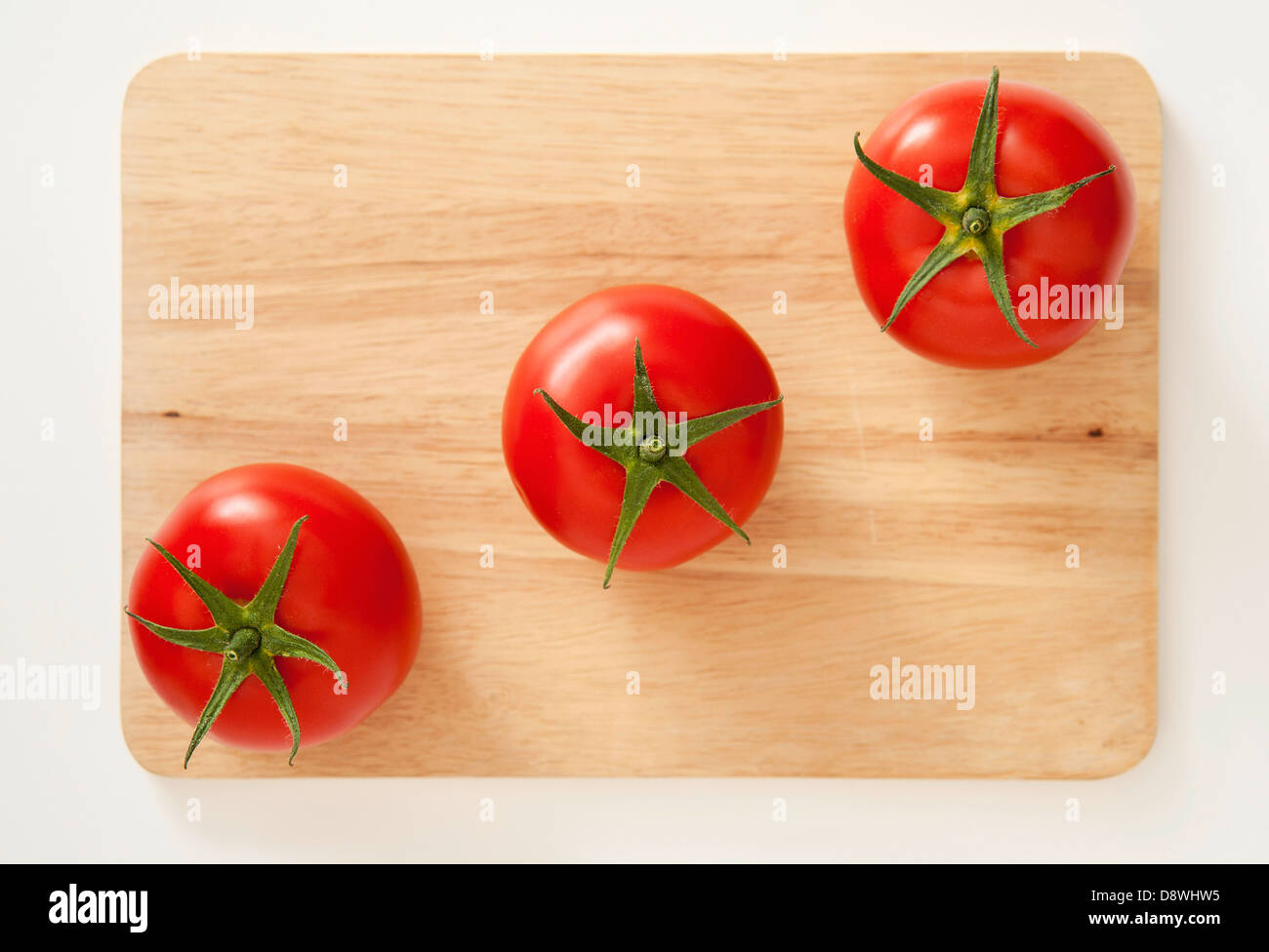 Three tomatoes Stock Photo