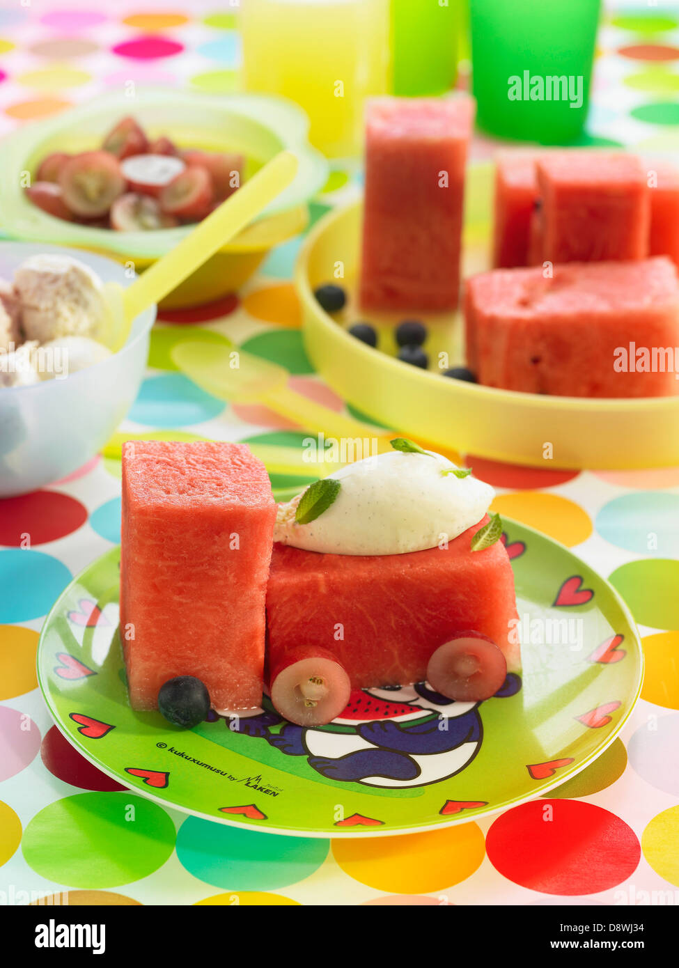 Lorry-shaped watermelon and ice cream dessert Stock Photo
