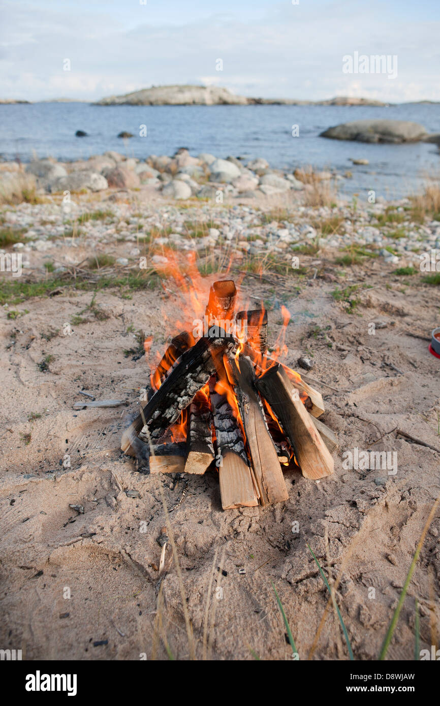 Open fire on beach Stock Photo