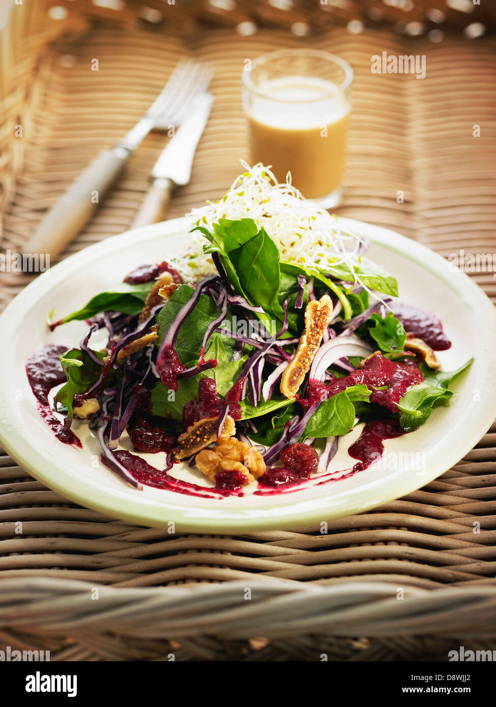 Organic red cabbage,dried fig,spinach and walnut salad Stock Photo