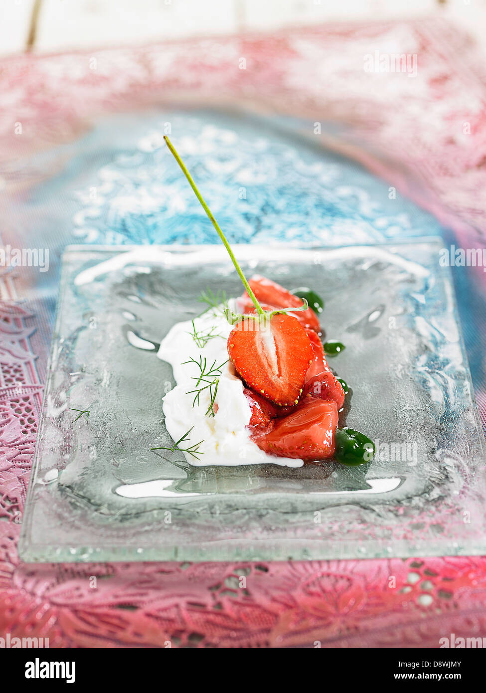 Strawberries with milk and basil jelly Stock Photo