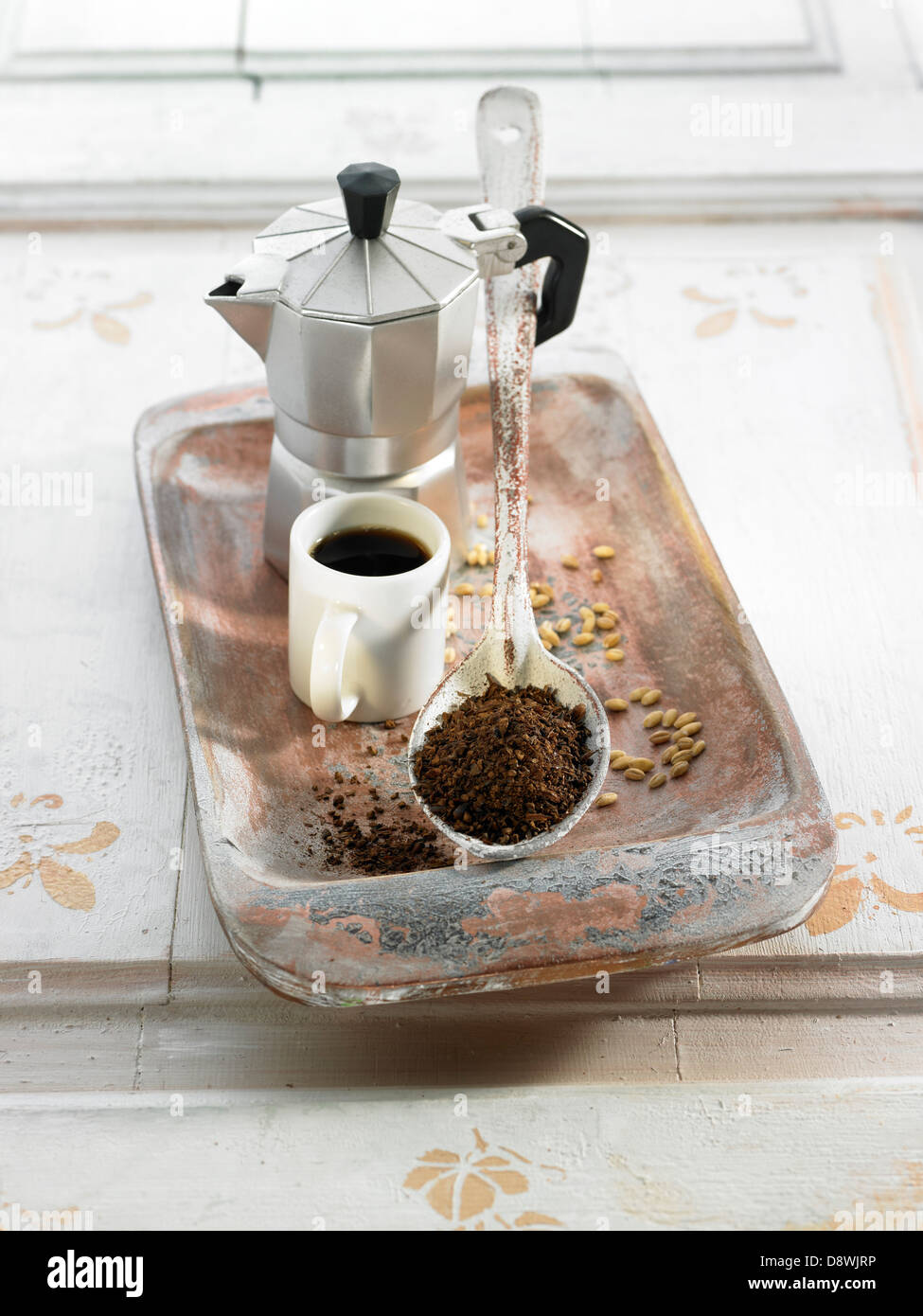 Spoonful of instant coffee,cup of black coffee and coffee pot Stock Photo