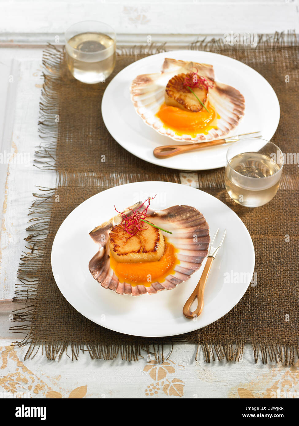 Scallops in sauce Stock Photo