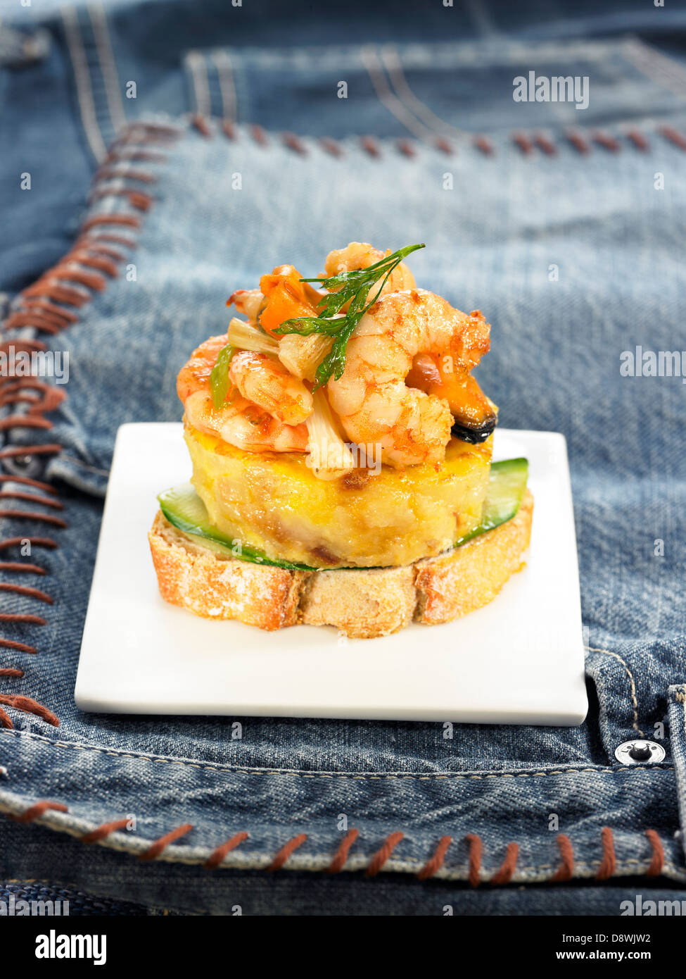 Shrimp,mild garlic and fennel omelette on a slice of bread Stock Photo