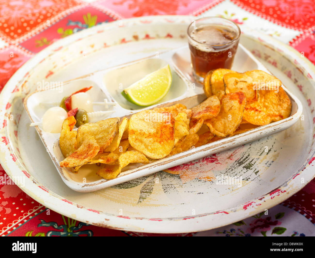 Aperitif tray with saffron-flavored crisps Stock Photo