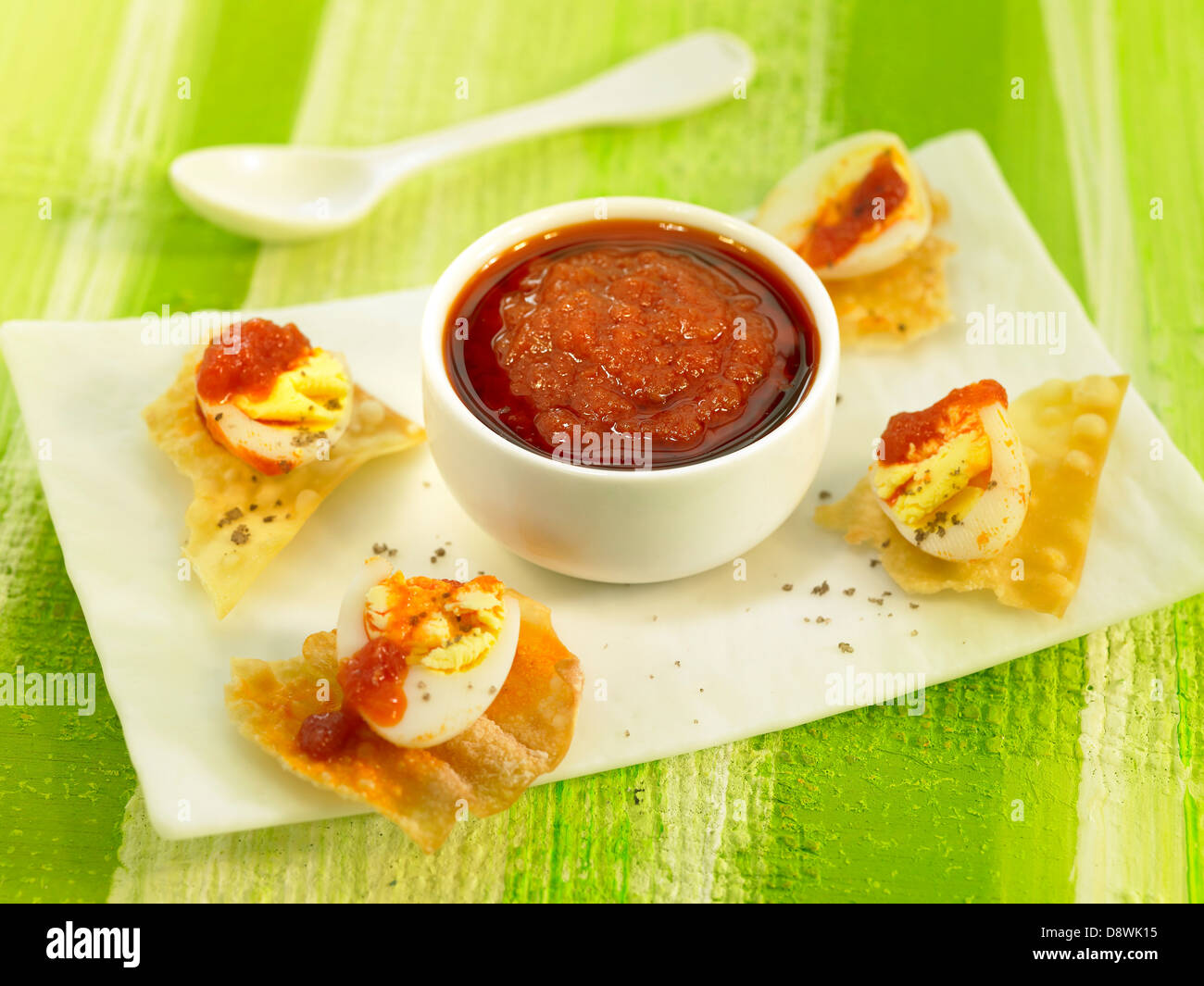 Tomato salsa with crispy egg appetizers Stock Photo