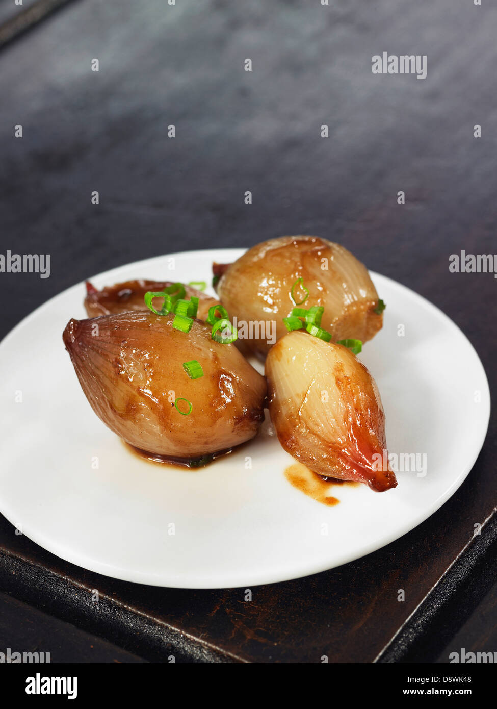 Shallots glazed with butter and white wine,vegetables for veal fillet Stock Photo