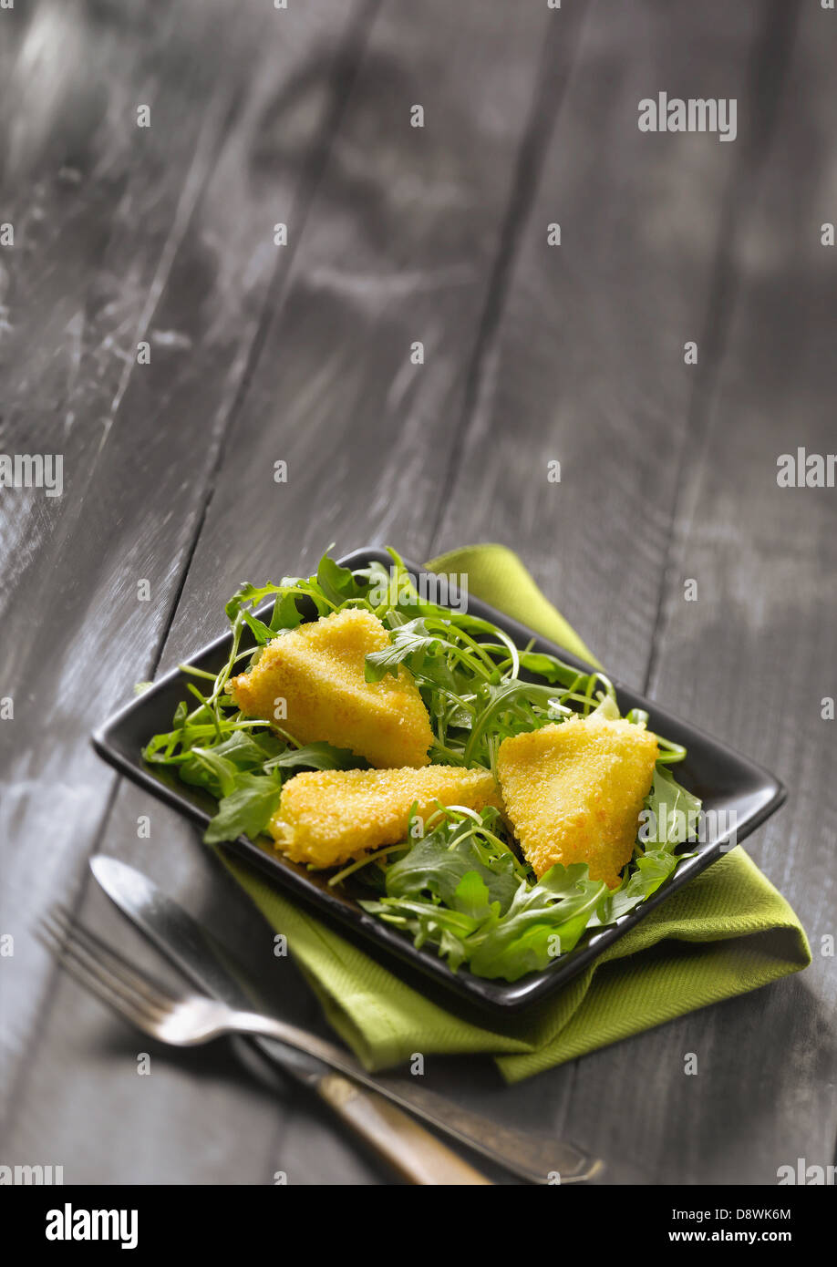 Camembert croquettes with rocket lettuce Stock Photo - Alamy