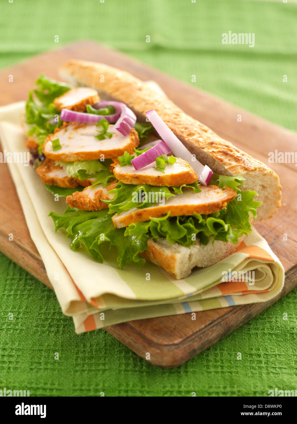 chicken salad lettuce raw onion sandwich roll fresh bread Stock Photo