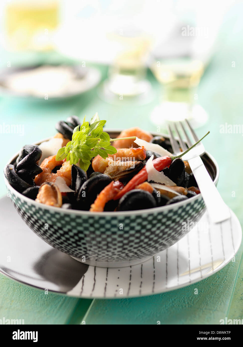 Squid ink pasta with seafood Stock Photo