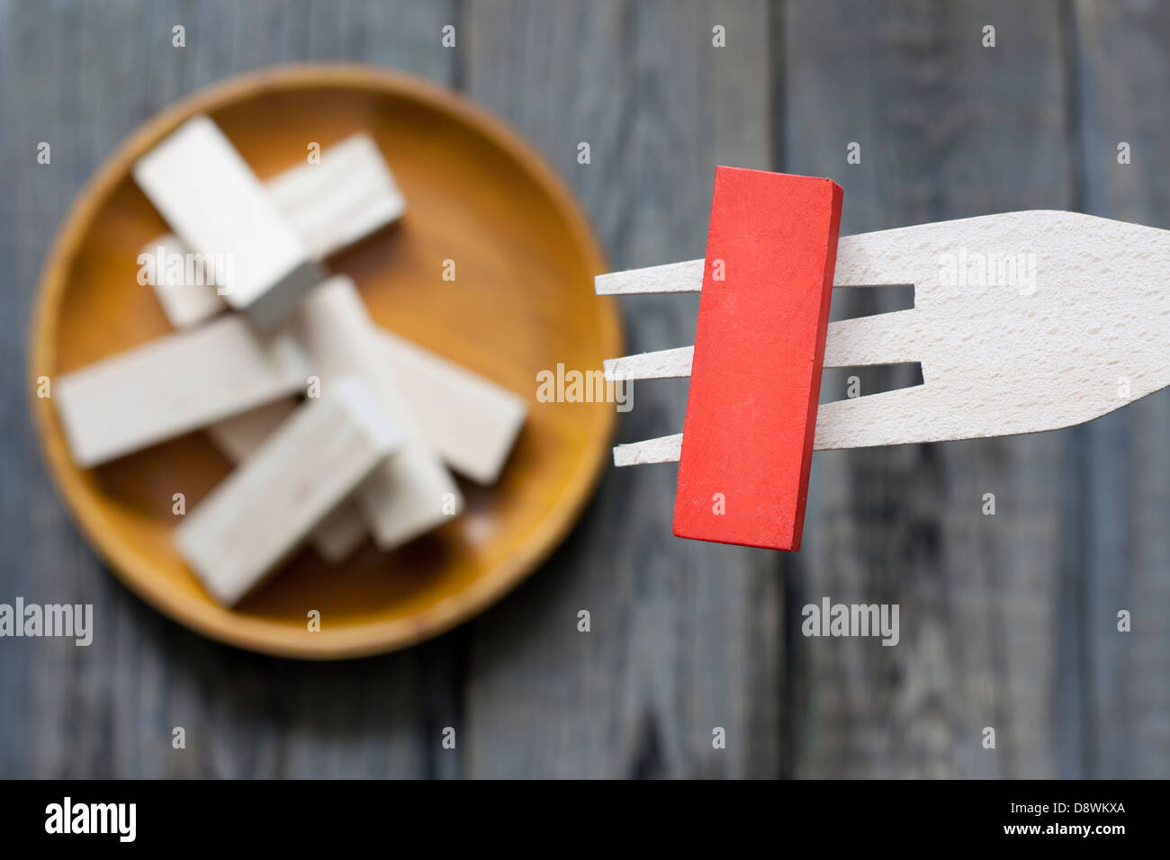 Unhealthy junk food creative concept comparison to wooden blocks Stock Photo