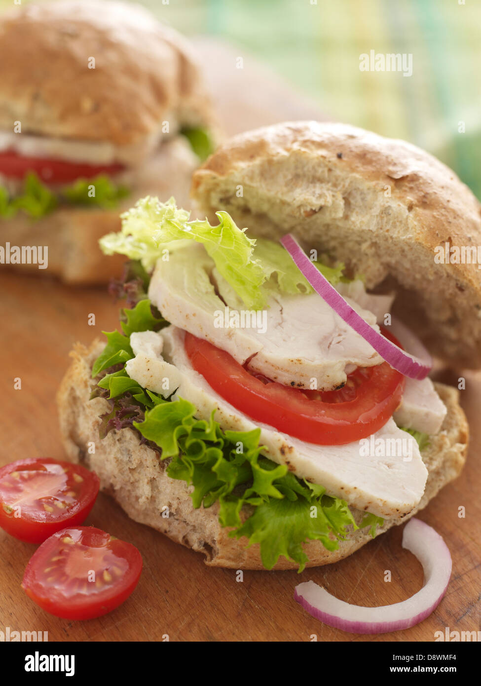 chicken turkey salad tomato tomatoes lettuce raw onion bread seeded seeds sandwich roll Stock Photo