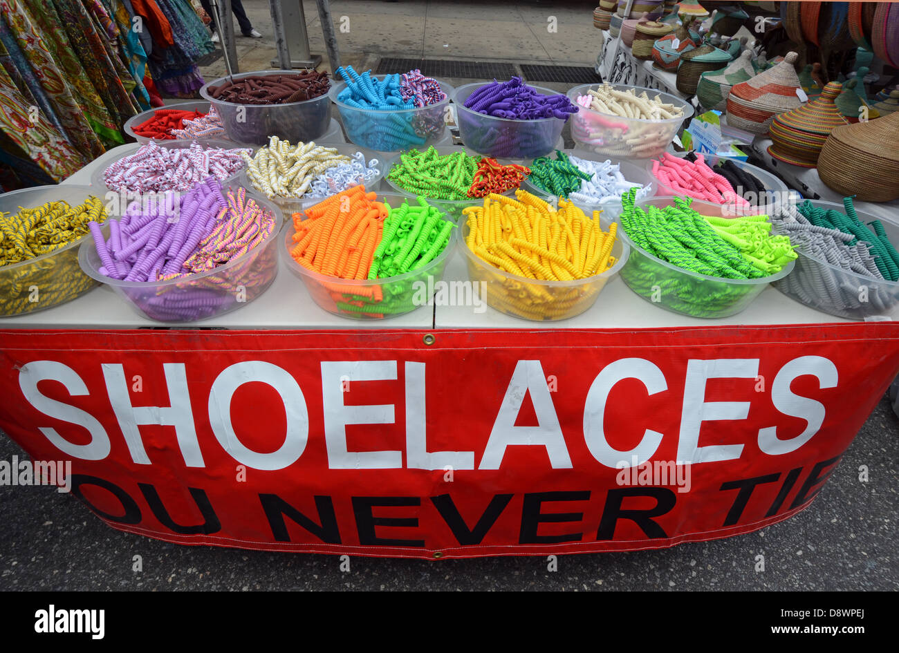 Shoelaces that don't need to be tied on sale at a street fair in Greenwich Village, New York City. Stock Photo