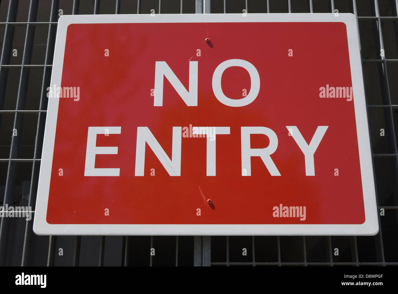 british no entry sign, fixed to a iron grille fence Stock Photo Alamy