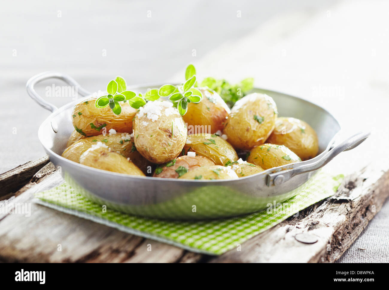 Sauteed Grenaille potatoes with coarse salt Stock Photo - Alamy