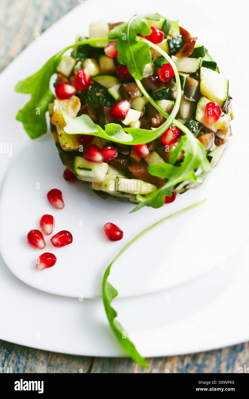 Zucchini,eggplant and pomegranate seed Timbale Stock Photo