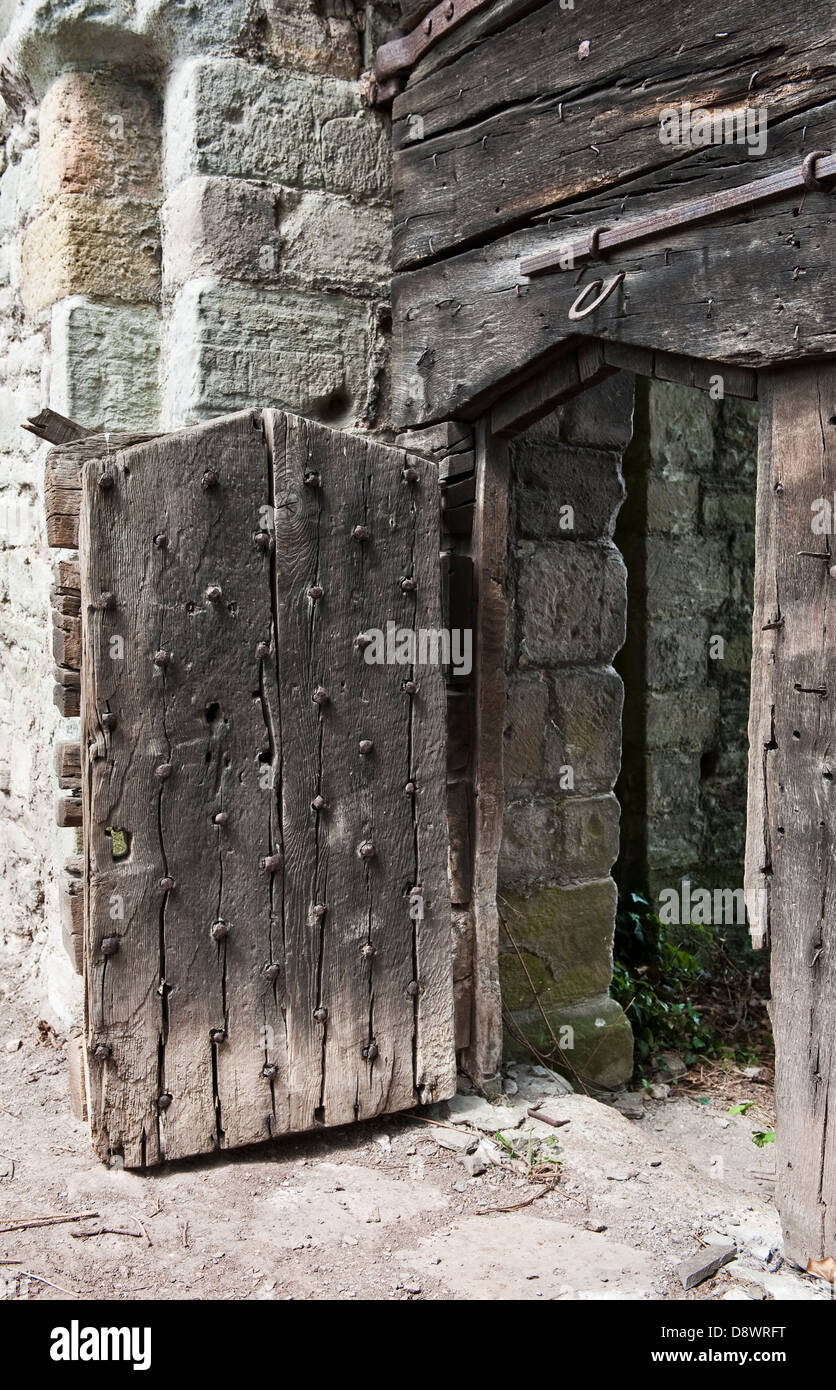 A wicket gate set into the huge early thirteenth century medieval gate of Hay Castle, Hay-on-Wye, UK Stock Photo