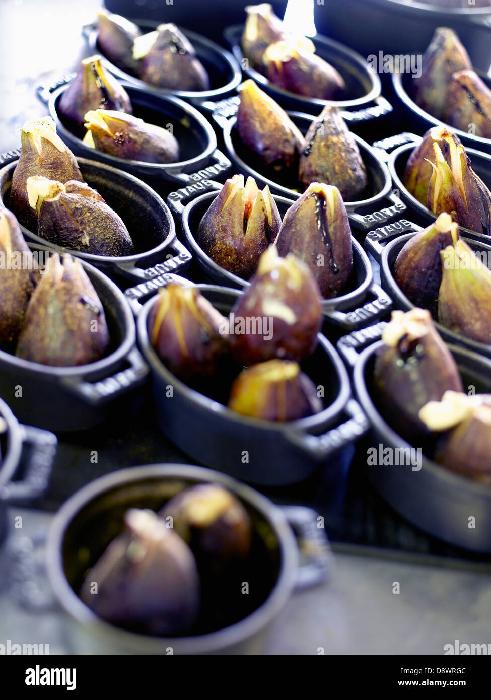 Baked chestnuts in small casserole dishes Stock Photo