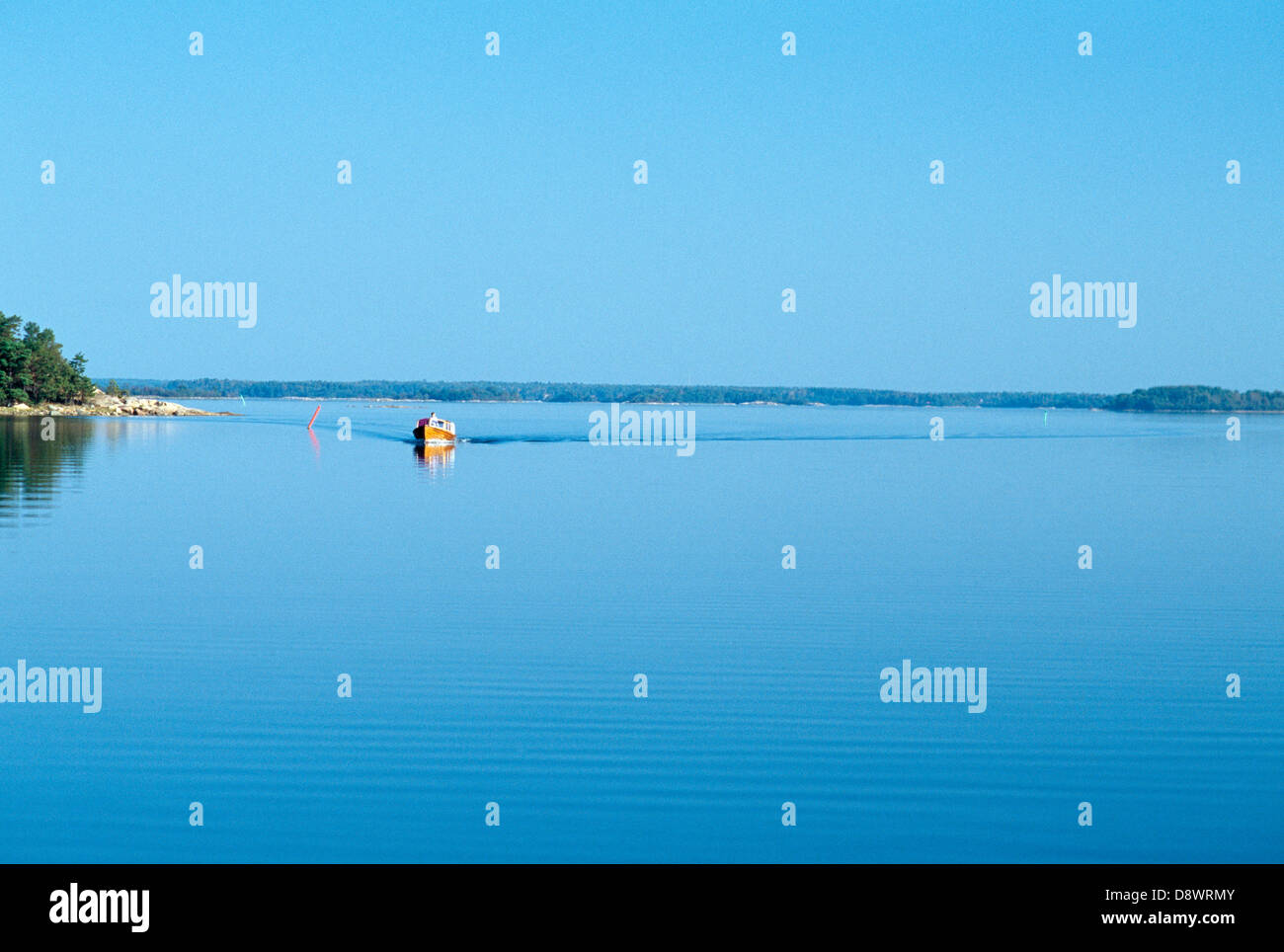 A Boat in Calm Water Stock Photo - Alamy