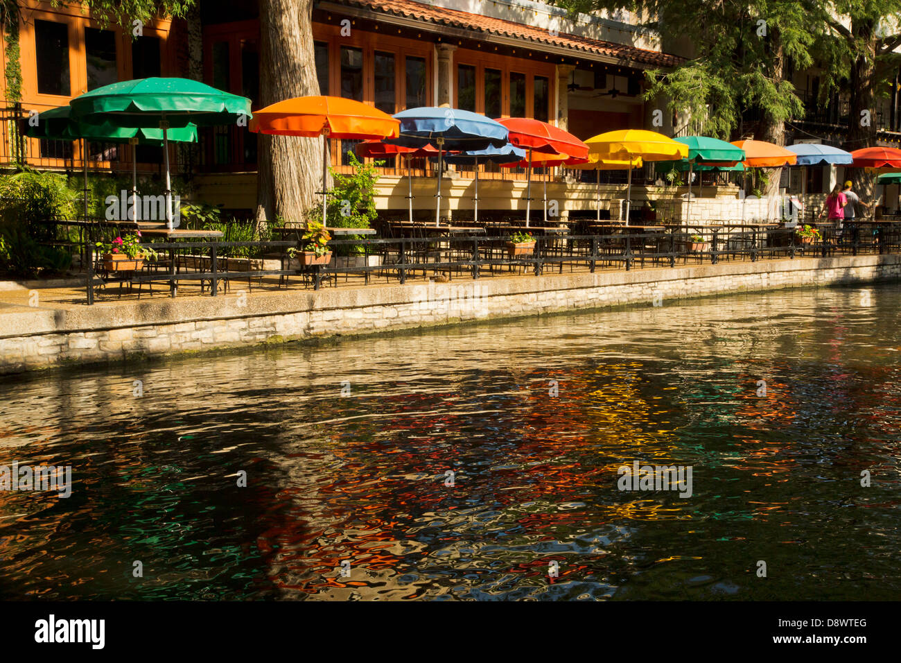 Café umbrellas along Riverwalk in San Antonio, Texas USA Stock Photo