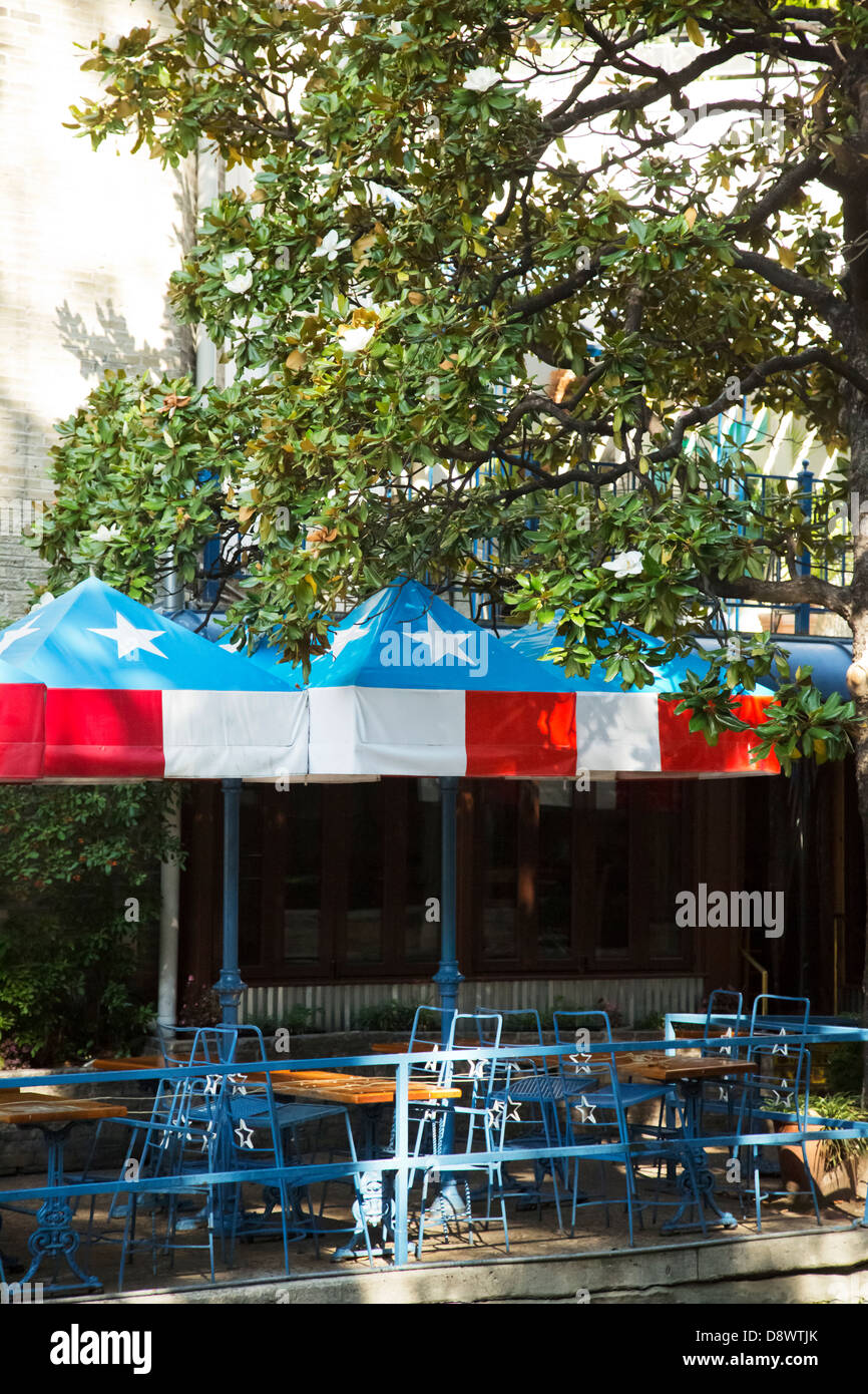 View of the café tables with Texas flag pattern on umbrellas, Riverwalk, San Antonio, Texas USA Stock Photo