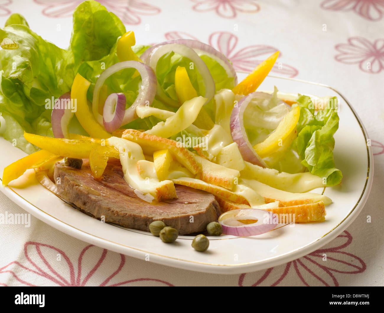 Cold roast beef with yellow pepper and Maroilles salad Stock Photo