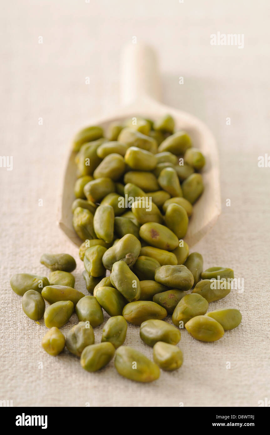 Scoopful of pistachios Stock Photo