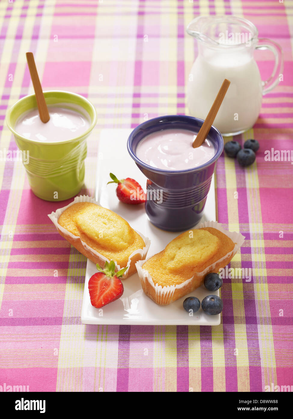 Summer fruit yoghurts with mini cakes Stock Photo