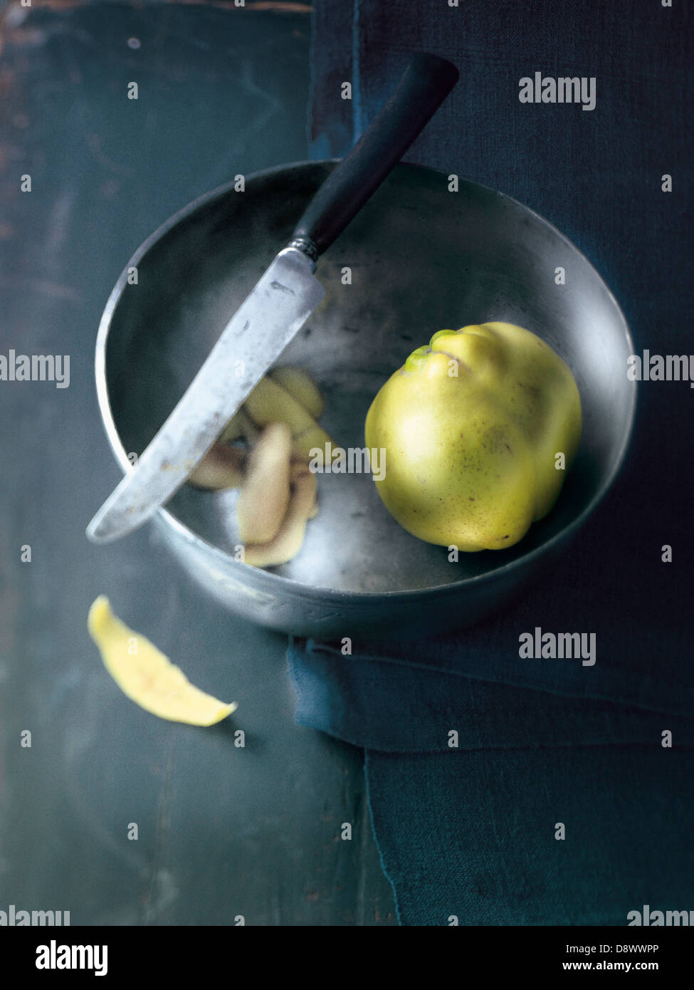 Peeling a quince Stock Photo
