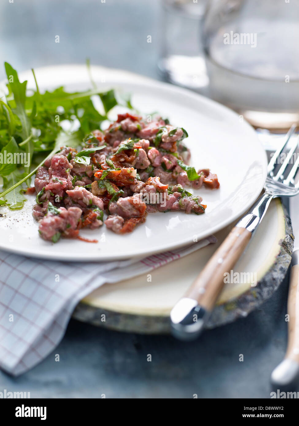 Duck tartare with herbs and confit tomatoes Stock Photo