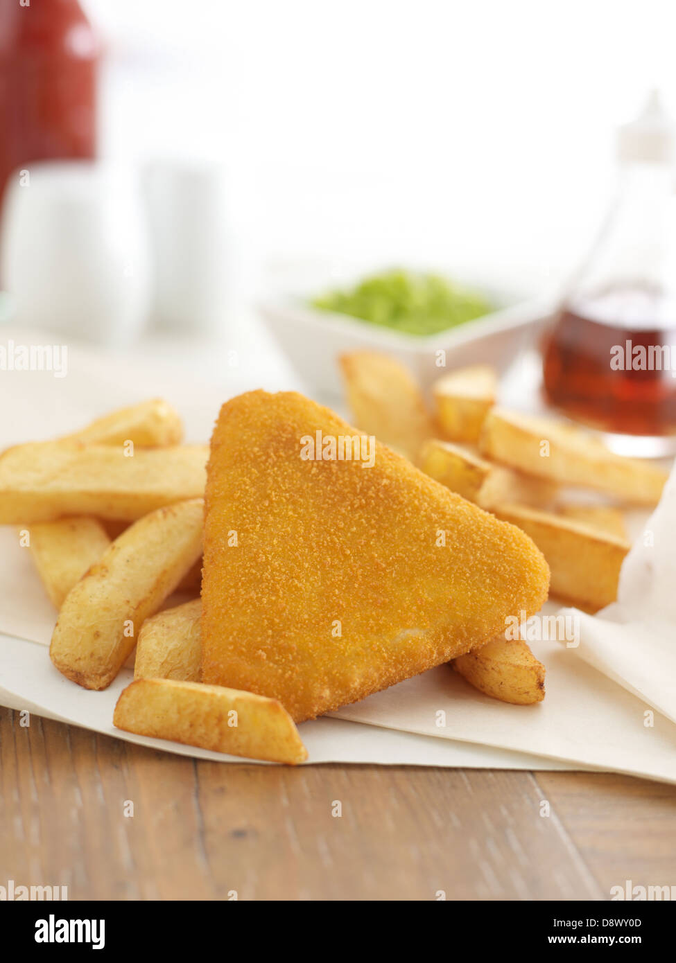 fishcakes chips mushy peas tomato sauce takeaway malt vinegar Stock Photo