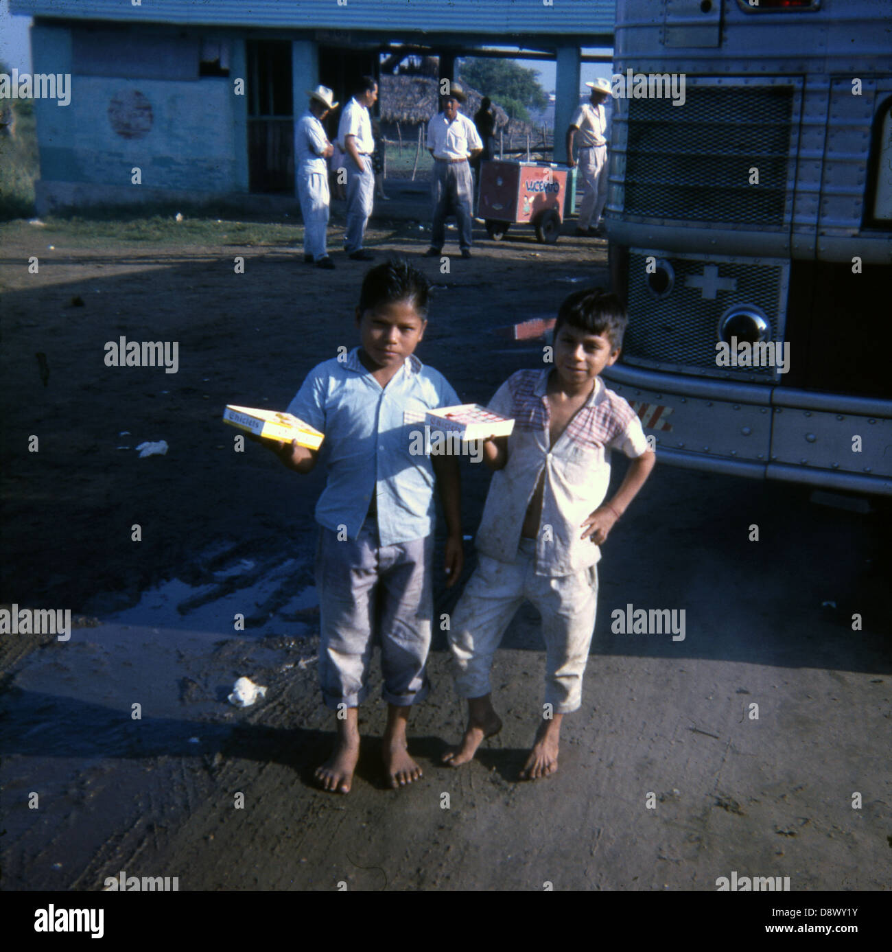 January 1965 photograph, young Mexican boys selling Chicklets gum to tourists in Mexico. Stock Photo