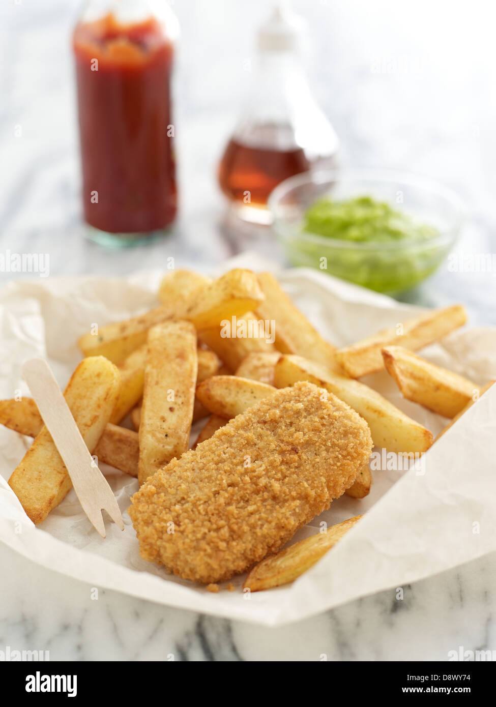 fishcakes chips mushy peas tomato sauce takeaway malt vinegar Stock