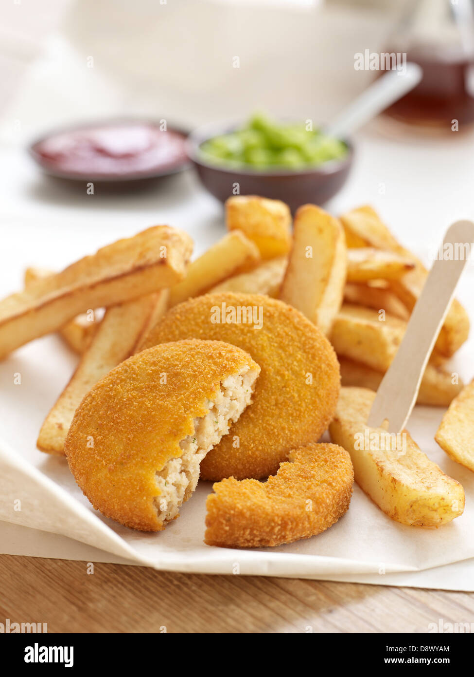 fishcakes chips mushy peas tomato sauce takeaway malt vinegar Stock